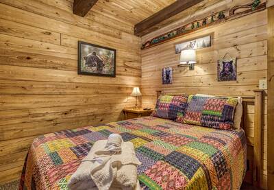Cedar Lodge - Main level bedroom two with queen size bed