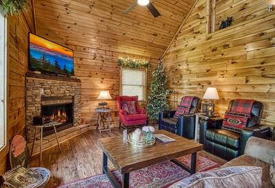 My Pigeon Forge Cabin - Living room with stone encased gas fireplace