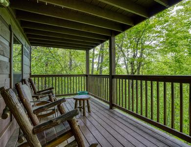 Beary Beary Special lower level covered back deck with rocking chairs