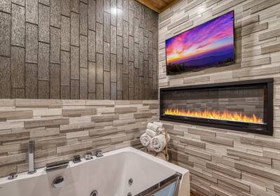 Spa Dee Dah - Bathroom with electric fireplace and 32-inch TV