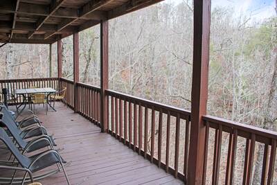 Emerald Forest - Lower level covered deck with rocking chairs