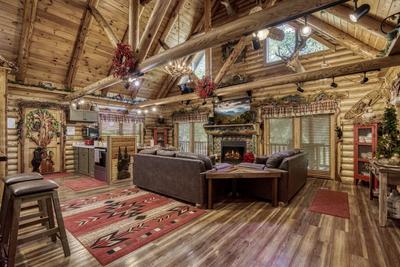 Creekside Lodge - Living room with stone encased gas fireplace