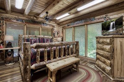 Creekside Lodge - Main level bedroom with king size log bed