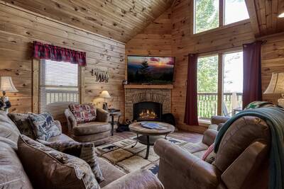 Black Bear Lodge - Living room with stone encased gas fireplace