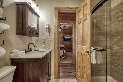 Black Bear Lodge - Bathroom 1 with walk in shower and single vanity