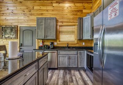 Wild Heart Lodge - Fully furnished kitchen with granite countertops and stainless steel appliances