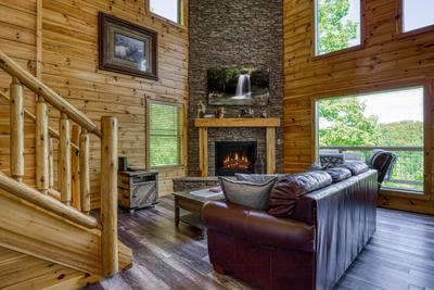 Wild Heart Lodge - Living room with stone encased gas fireplace