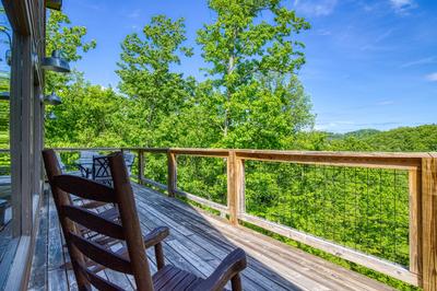 Wild Heart Lodge - Wrap around deck with rocking chairs