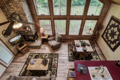 Reflections - Floor to ceiling windows in living room