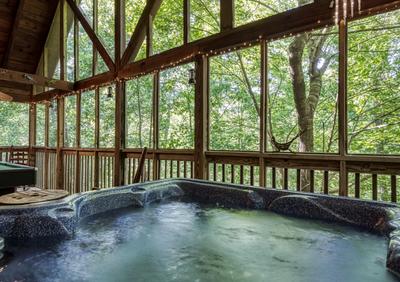 Papa's Pad screened in back deck with hot tub