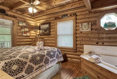 A Smoky Getaway - Main level bedroom 1 with in-room whirlpool tub