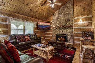 4 Paws Lodge living room with stone encased fireplace