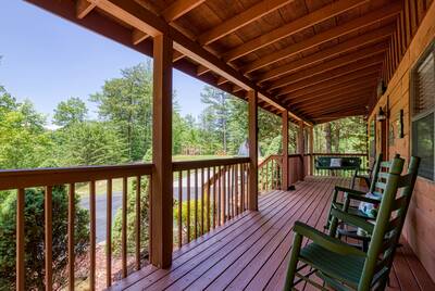 Serenity Ridge - Covered entry deck with rocking chairs and swing