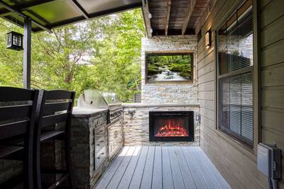 Majestic Poolside Lookout - Covered back deck with TV and fireplace