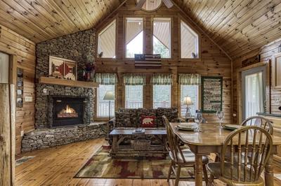 Possum Moon - Living room with stone encased gas fireplace