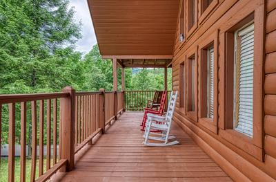 Possum Moon - Covered wrap around deck with rocking chairs