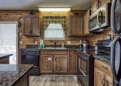 Rustic Acres fully furnished kitchen with granite countertops