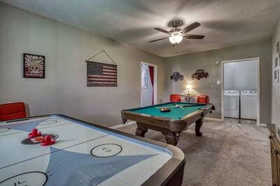 Rustic Acres game room with air hockey table