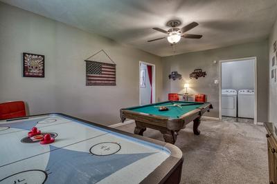 Rustic Acres game room with air hockey table