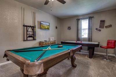 Rustic Acres game room with pool table