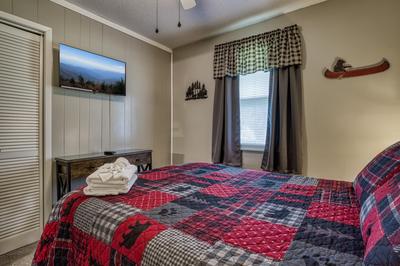 Rustic Acres bedroom with a queen size bed