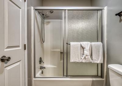 Rustic Acres bathroom with a tub/shower combo