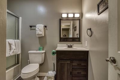 Rustic Acres bathroom with a tub/shower combo