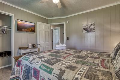 Rustic Acres bedroom with a queen size bed