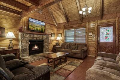 Caddy Shack Lodge living room with stone encased gas fireplace