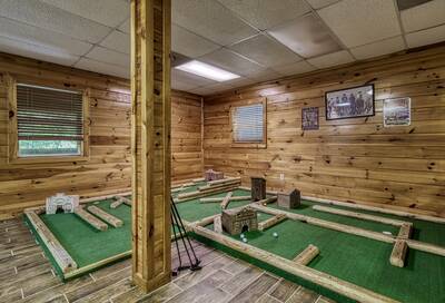 Caddy Shack Lodge lower level game room with putt putt course