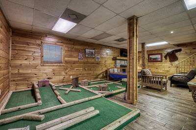 Caddy Shack Lodge lower level game room with mini golf course