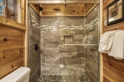 Caddy Shack Lodge upper level bathroom with walk in shower