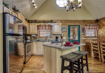 A Beary Good Time fully furnished kitchen with granite countertops