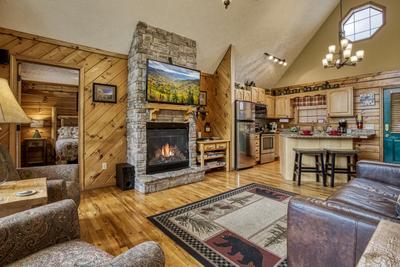 A Beary Good Time living room with stone encased gas fireplace