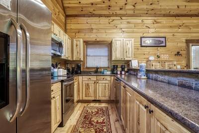 The Bear Cubs fully furnished kitchen with stainless steel appliances