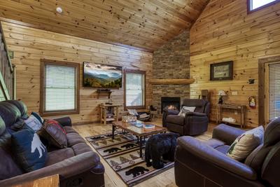 The Bear Cubs living room with stone encased gas fireplace