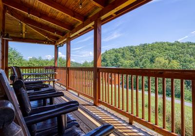 The Bear Cubs wrap around deck with rocking chairs