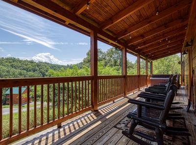 The Bear Cubs wrap around deck with rocking chairs