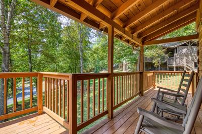 Owl's Nest covered entry deck with rocking chairs