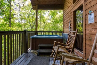 Angels Gift covered back deck with hot tub