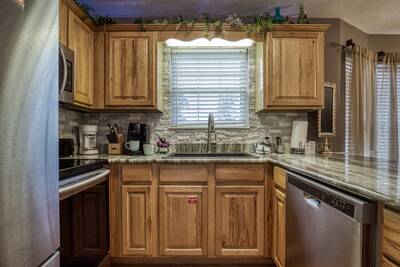 Striking Waters fully furnished kitchen with granite countertops