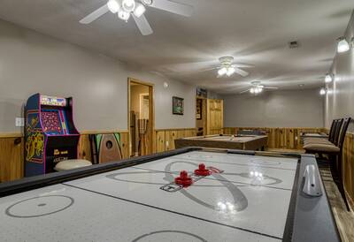 Striking Waters game room with air hockey table