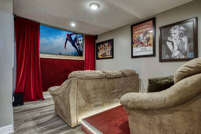 Striking Waters theater room with 70 inch TV