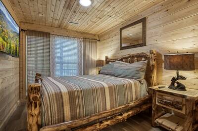Striking Waters lower level bedroom with a queen size bed