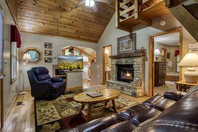 Allen Hideaway living room with stone encased fireplace