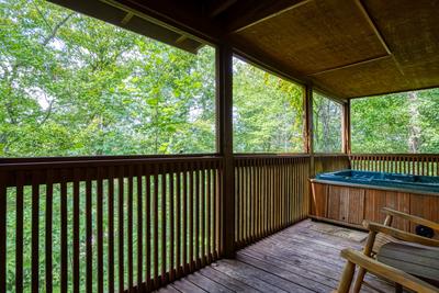 Antler Crossing covered back deck with hot tub