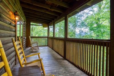 Antler Crossing covered back deck with rocking chairs