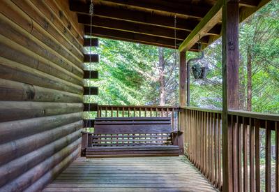 Antler Crossing covered entry deck with swing