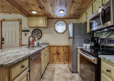 Treeside fully furnished kitchen with granite countertops