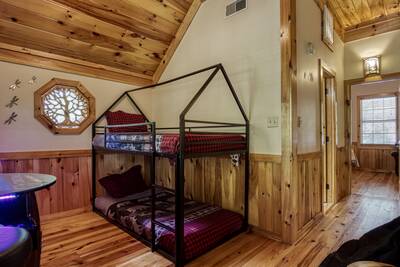 Treeside upper level loft area with bunk beds